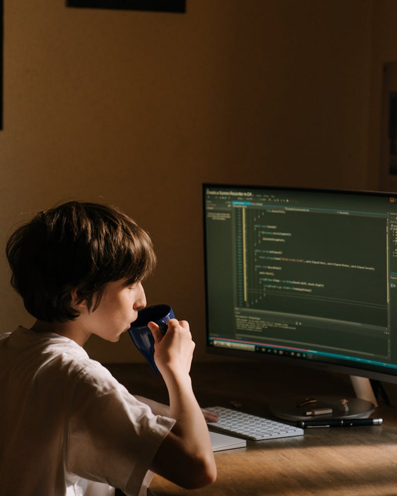 Student smiling while working on project